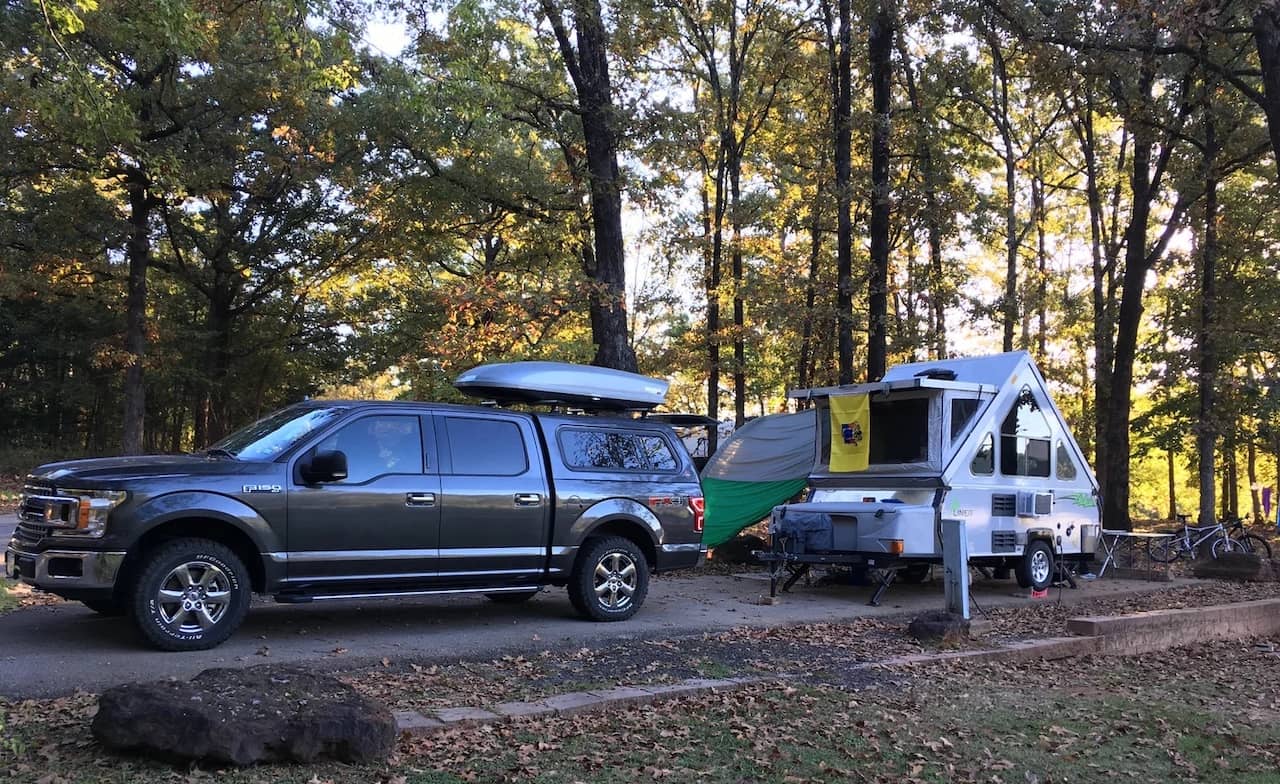 Best-RV-Campgrounds-in-Texas-1.jpg Truck and camper at Texas Tyler State Park Campground
