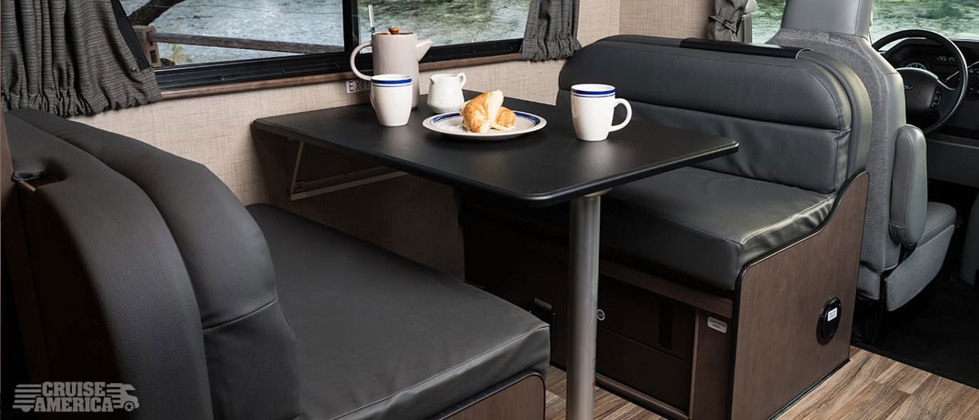 Enjoy breakfast at the dinette in a standard Cruise America RV rental.